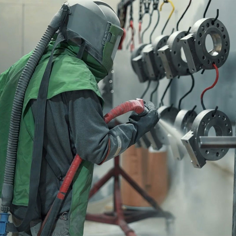 powder coating being applied